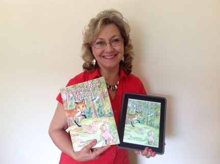 Big Day! Linda holding her her hands her newly published book and now, the Kindle book!